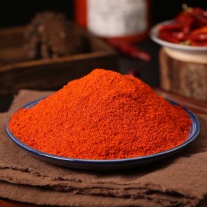 Huaxi fine-ground chili powder on a blue rimmed plate