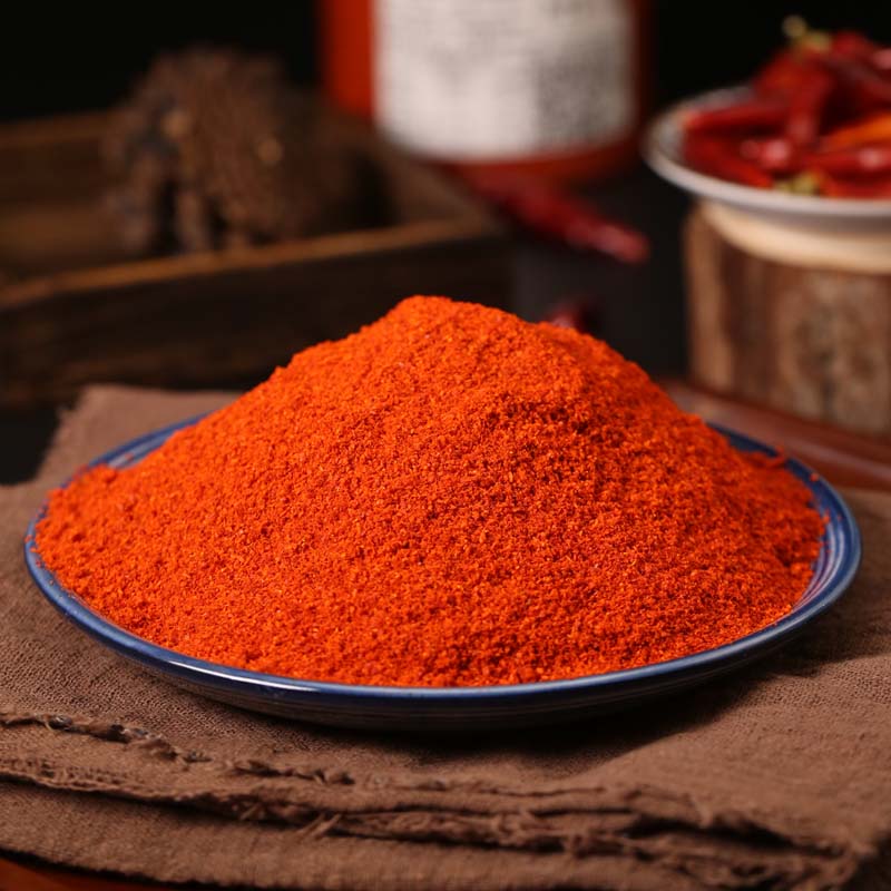 Huaxi fine-ground chili powder on a blue rimmed plate