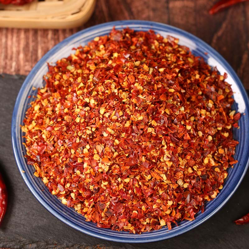 Huaxi coarse-ground chili powder on a blue rimmed plate