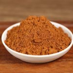 Ground star anise in a white bowl