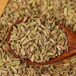 Fennel seeds on a wooden spoon