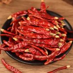 Xiaomila dried chili peppers on a black plate