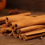 Cinnamon bark bundled on a wooden table