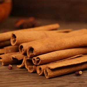 Cinnamon bark bundled on a wooden table