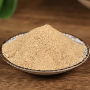Ground white pepper on a blue rimmed dish