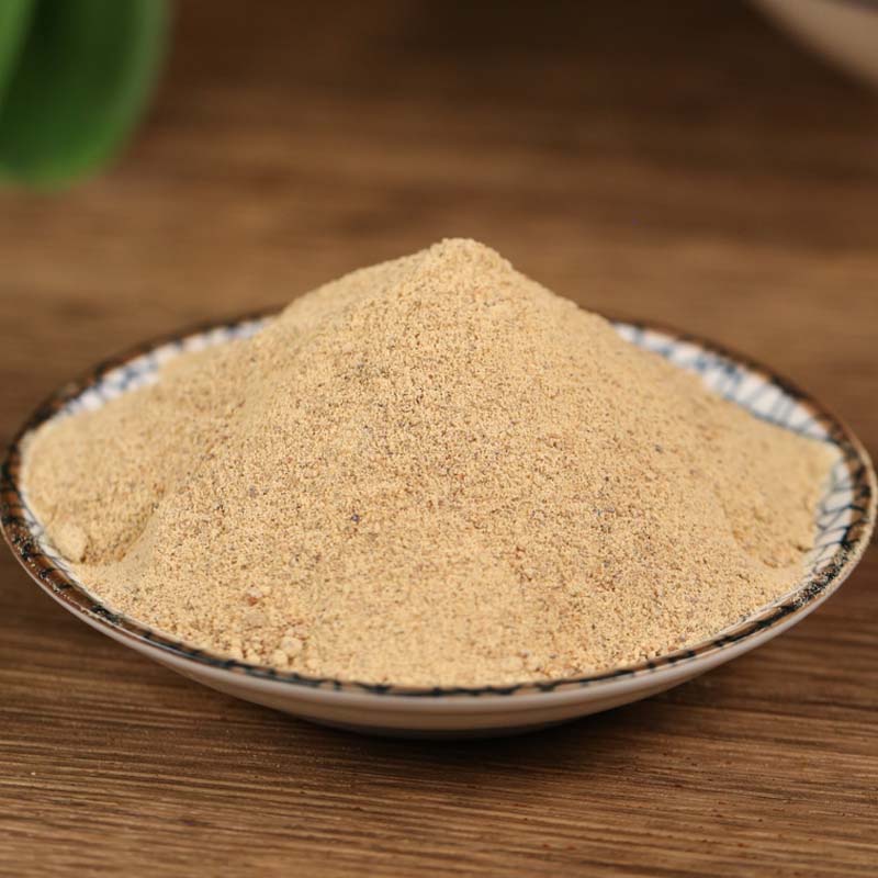 Ground white pepper on a blue rimmed dish