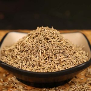 Cumin seeds in a black bowl