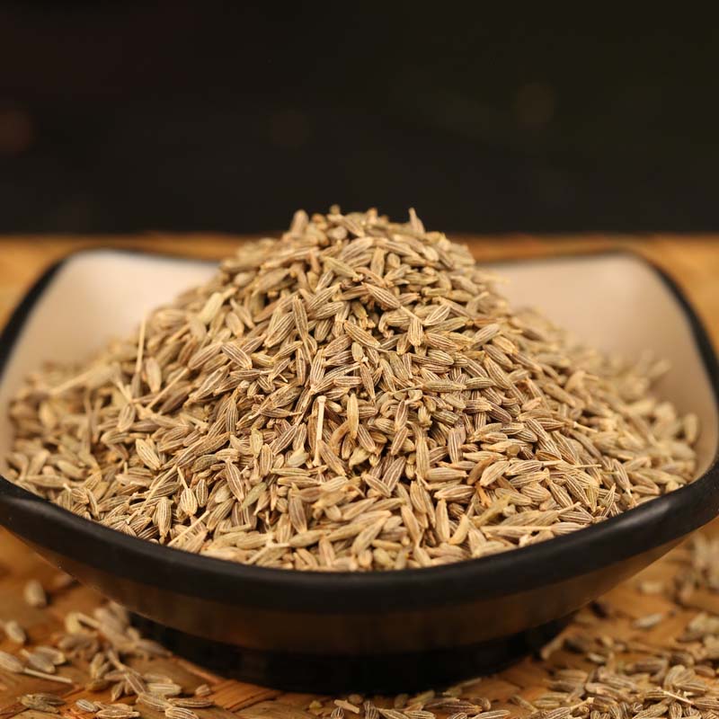 Cumin seeds in a black bowl