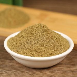 Ground cumin in a white bowl