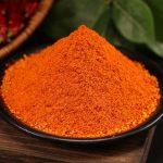 Mala chili dipping seasoning mounded on a black dish