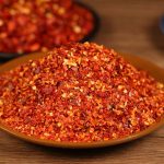 Five-variety ground chili blend on a brown plate