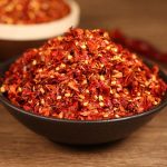 Xiaomila crushed chili flakes in a black bowl
