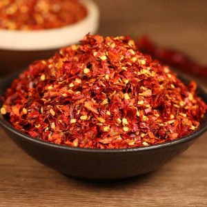 Xiaomila crushed chili flakes in a black bowl
