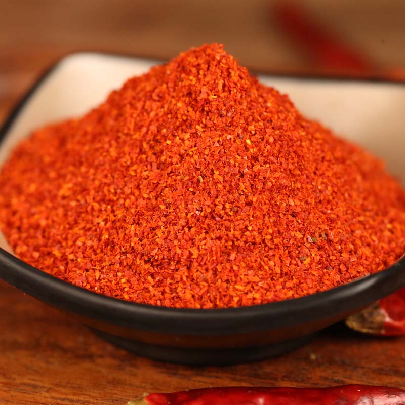 Xiaomila fine chili powder in a black bowl