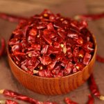 Xiaomila dried chili segments in a wooden bowl