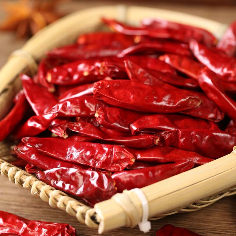 Xinyidai dried chili peppers in a bamboo basket