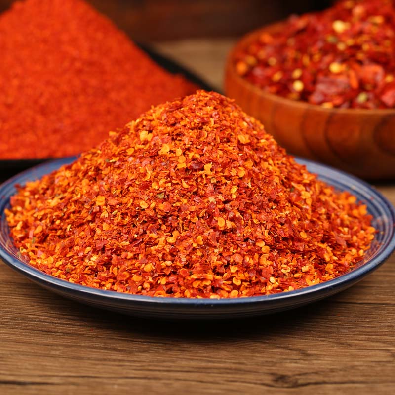Super hot coarse chili powder heaped on a blue-rimmed plate