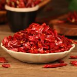 Xinyidai dried chili segments in a white dish