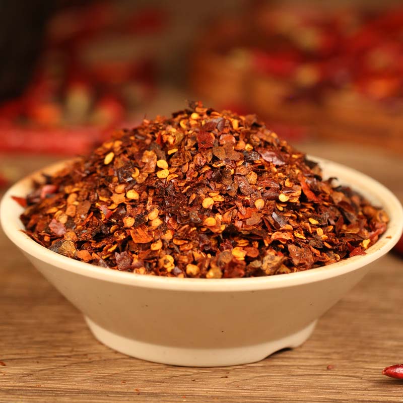 Roasted chili powder in a white bowl