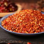 Huaxi coarse-ground chili powder in a blue rimmed dish