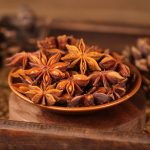 Star anise on a wooden plate