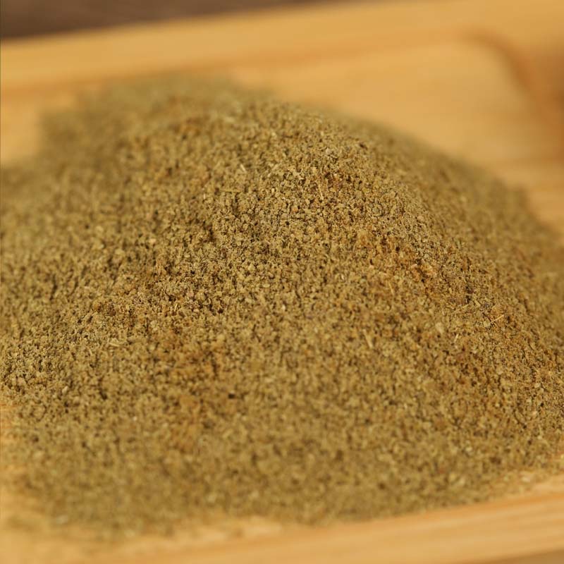 Ground cumin mounded on a wooden board