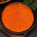 Mala chili dipping seasoning in a black bowl