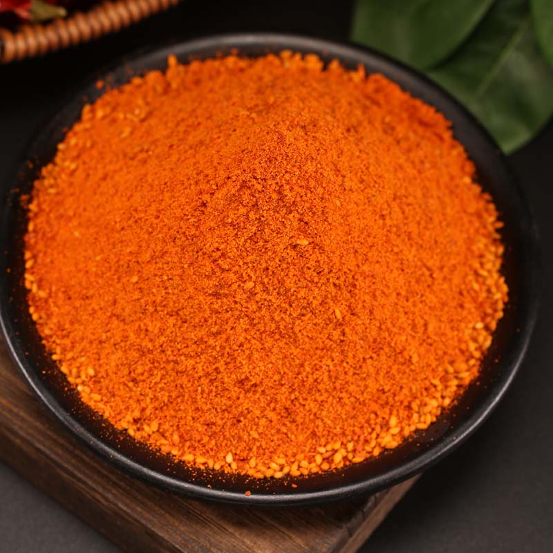 Mala chili dipping seasoning in a black bowl