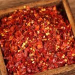 Xiaomila crushed chili flakes in a wooden box