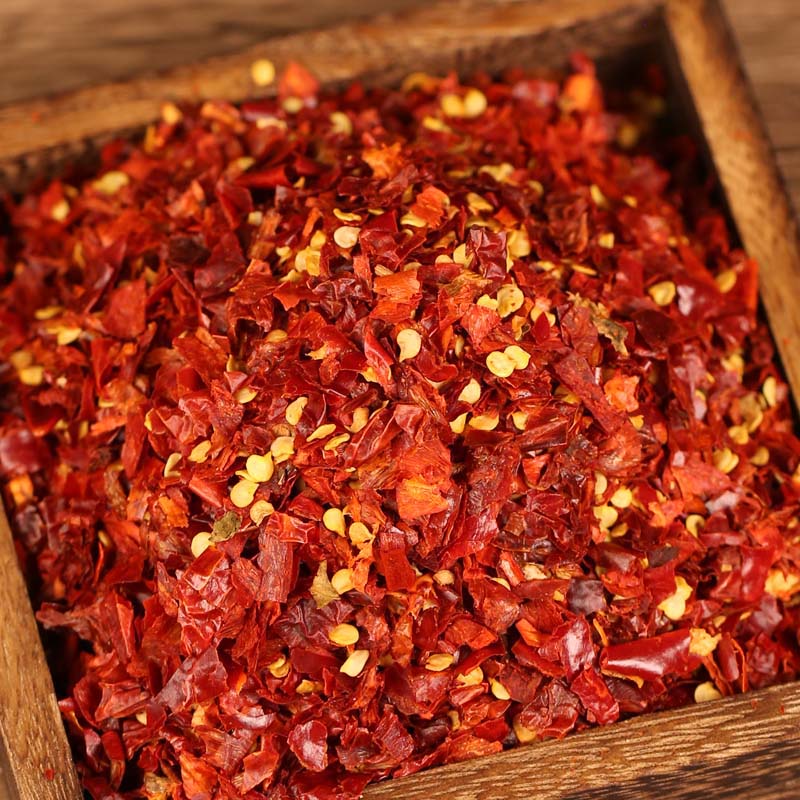 Xiaomila crushed chili flakes in a wooden box