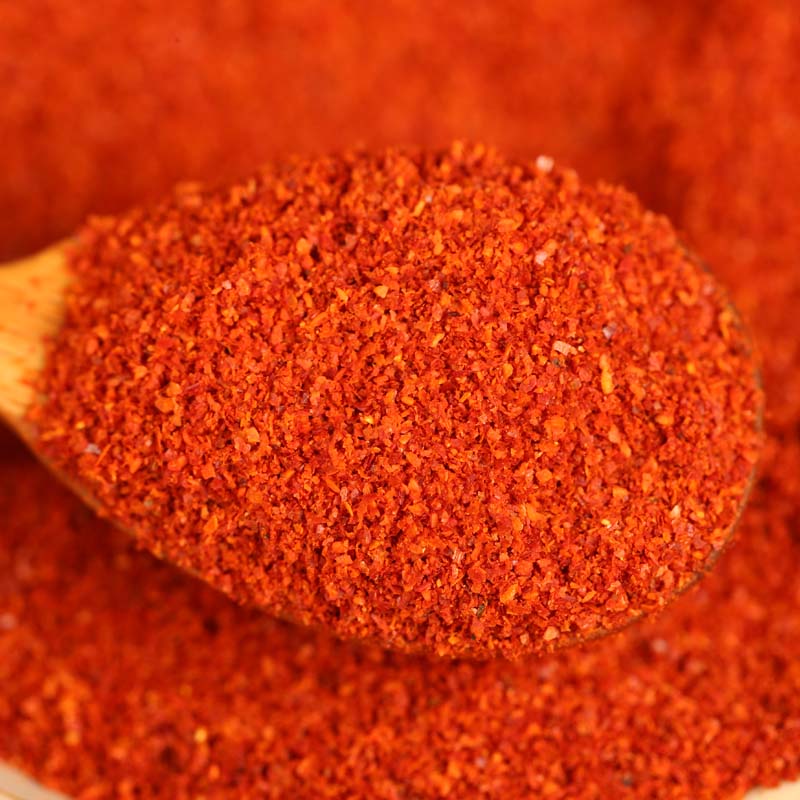 Xiaomila fine chili powder on a wooden spoon
