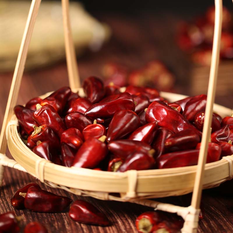 Zidantou dried chili peppers in a bamboo basket with a handle