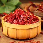 Huaxi chili threads in a wooden bucket