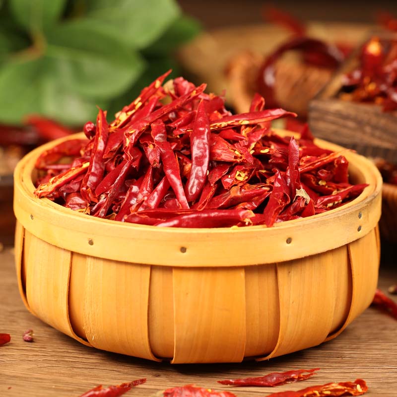 Huaxi chili threads in a wooden bucket