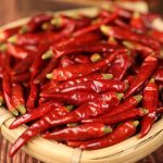 Mantianxing dried chili peppers in a bamboo sieve