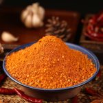 Five-spice chili dipping seasoning heaped in a blue bowl
