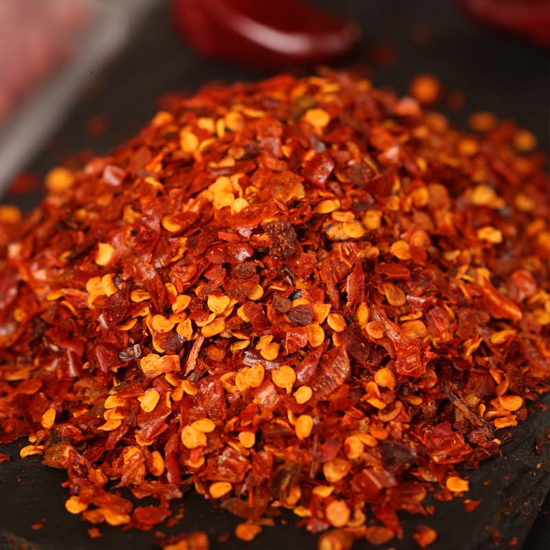 Chili powder for chili oil heaped on a dark table