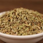 Fennel seeds in a white bowl