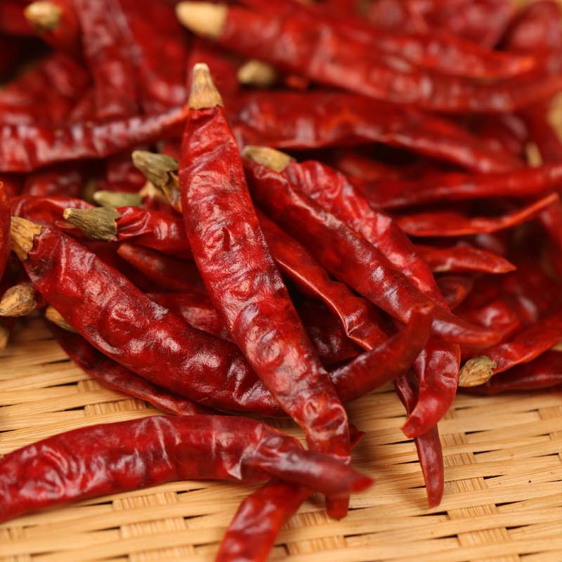 Xiaomila dried chili peppers on a bamboo mat