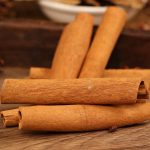 Cinnamon bark a few sticks on a wooden table