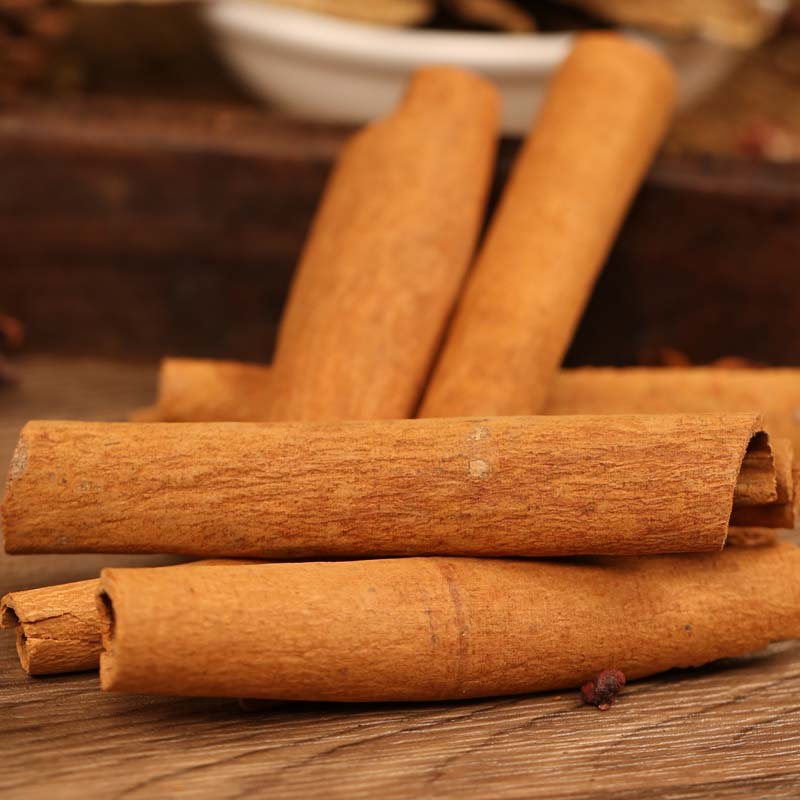 Cinnamon bark a few sticks on a wooden table
