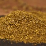 Green Sichuan pepper powder mounded in close-up