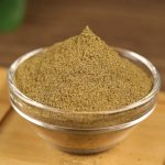 Ground cumin in a glass bowl