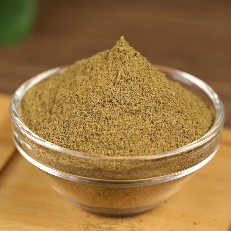 Ground cumin in a glass bowl