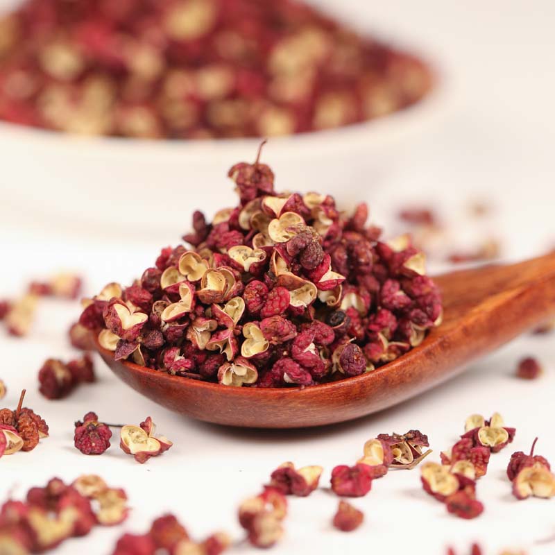 Meihua red Sichuan peppercorns on a wooden spoon