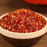 Five-variety ground chili blend in a dark bowl