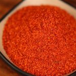Xiaomila fine chili powder heaped in a black dish