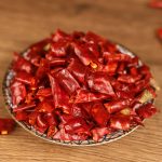 Xiaomila dried chili segments on a patterned plate