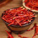 Xiaomila chili threads in a dark bowl