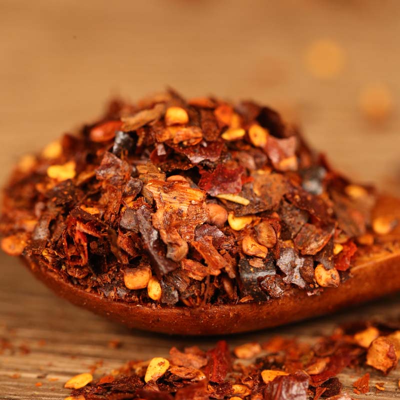 Roasted chili powder in a wooden bowl